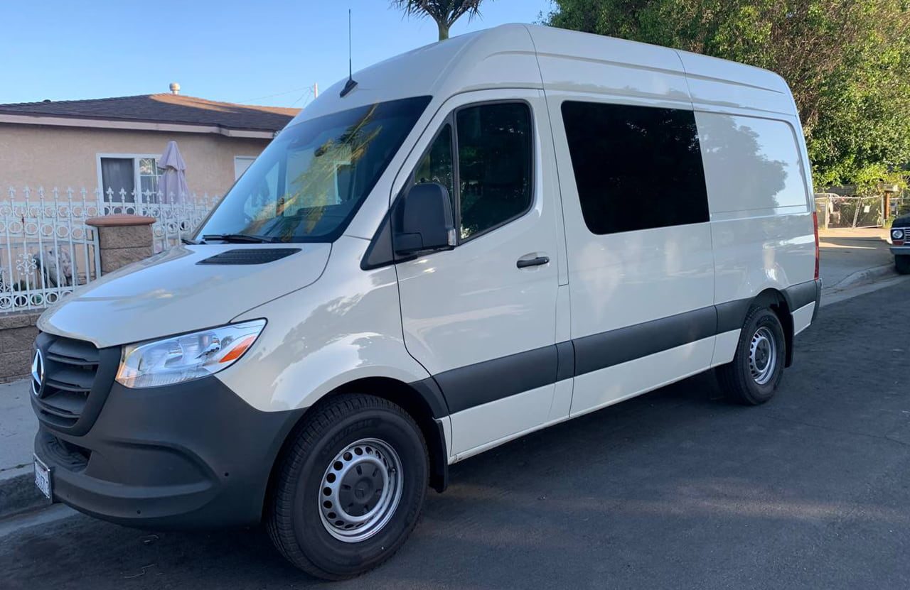 Mercedes-Benz Sprinter 5 seater crew cargo van with the short 144 inch wheelbase parked on a street