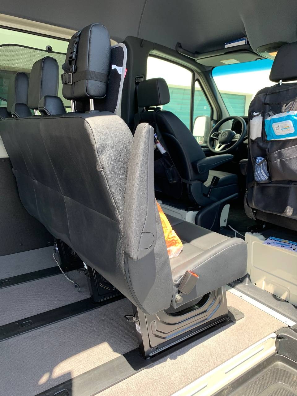 Rear bench seat behind the driver and passenger bucket seats in the 5 seater crew cargo Sprinter