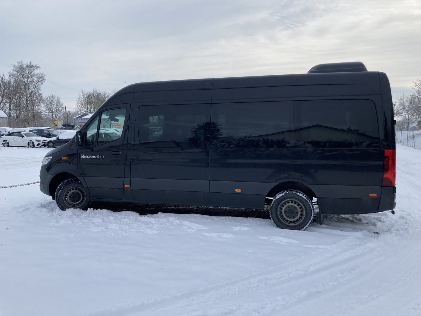 Mercedes-Benz Sprinter 9 seater van parked in the snow in Germany