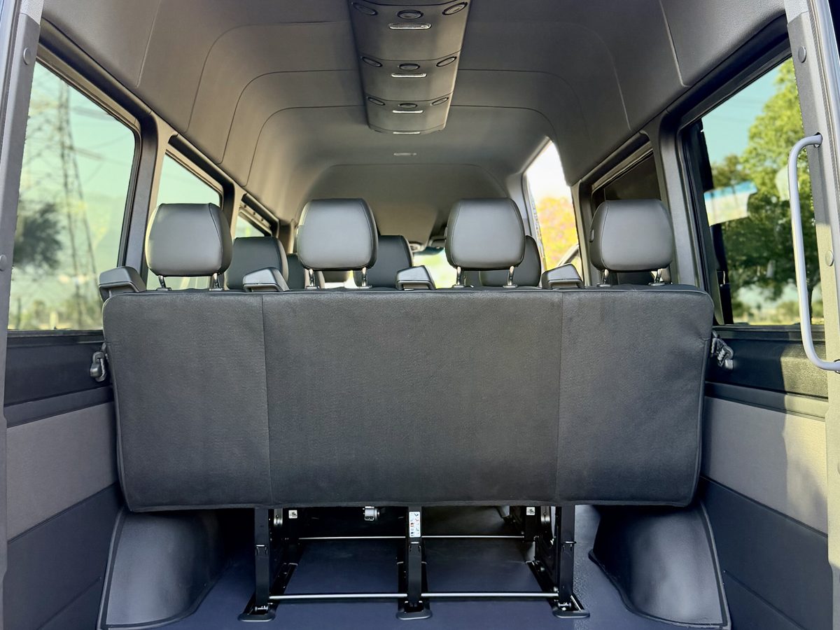 Interior seating rows of a 15-passenger Sprinter van rental serving Anaheim and the Disneyland Resort area