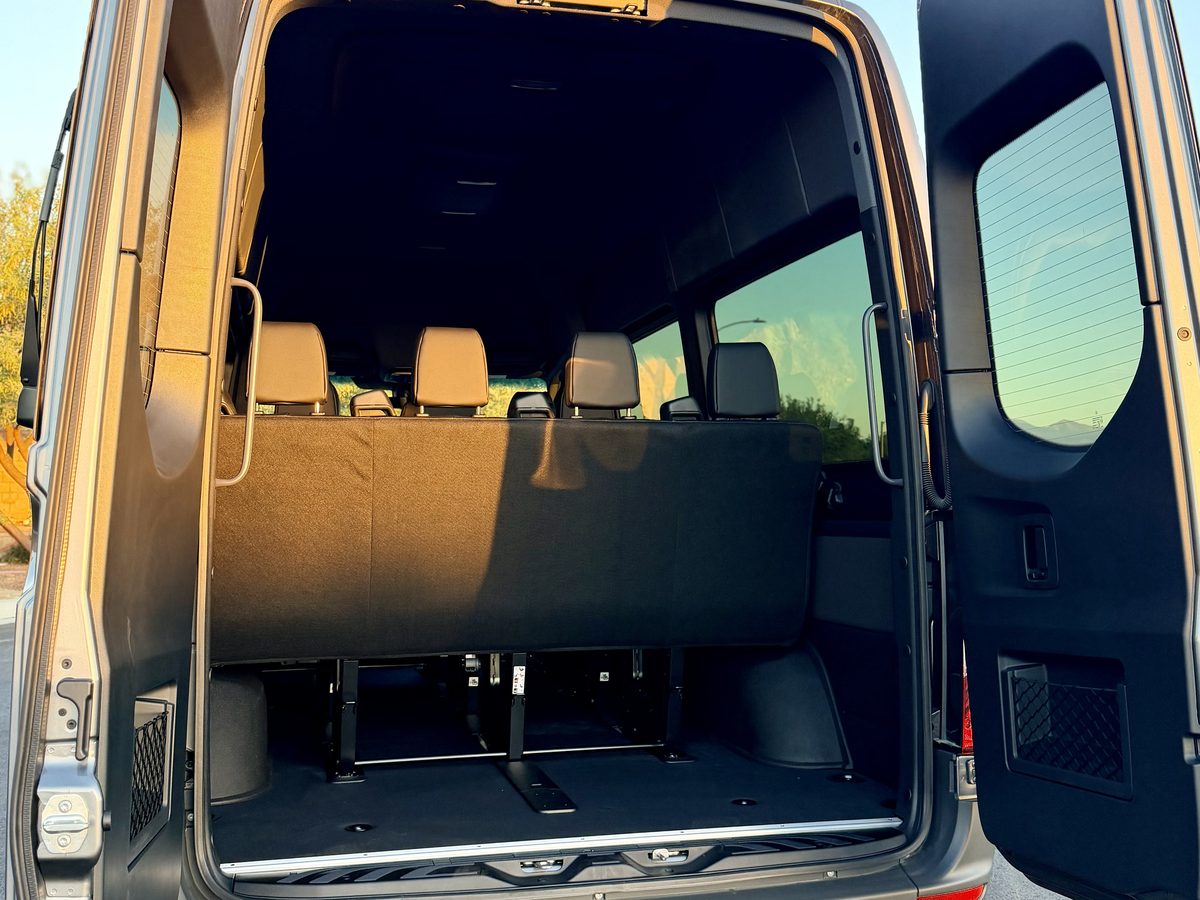 Sprinter passenger van with rear doors open showing the rear bench seat — Anaheim van rental near Angel Stadium and ARTIC