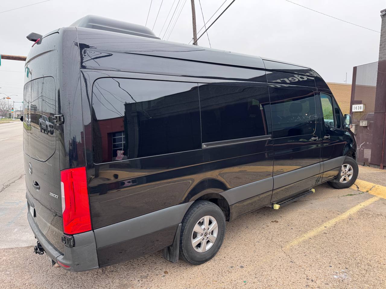 15-seater black Sprinter van exterior in Dallas, Texas