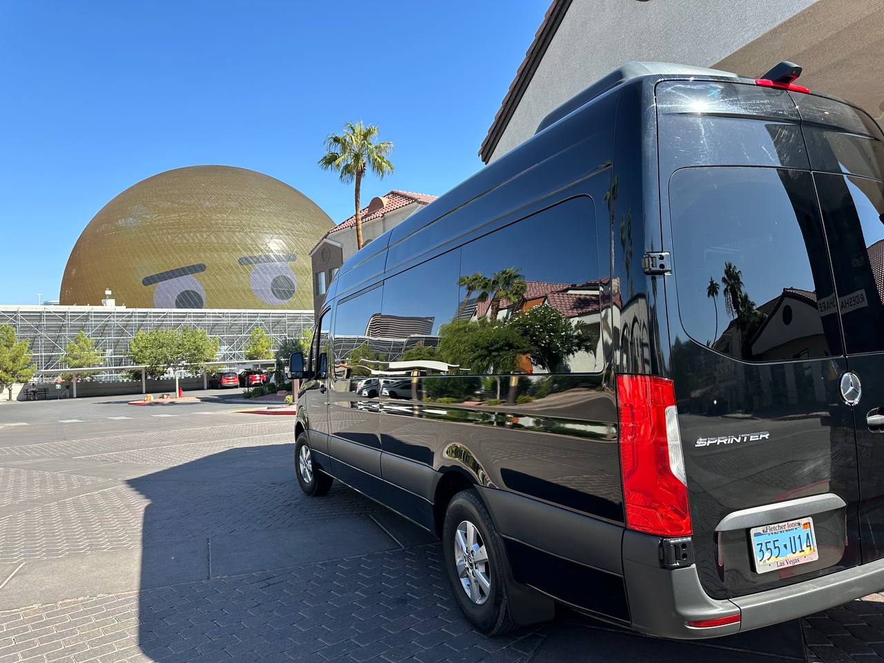 Black Mercedes-Benz Sprinter passenger van rental at the Las Vegas Sphere
