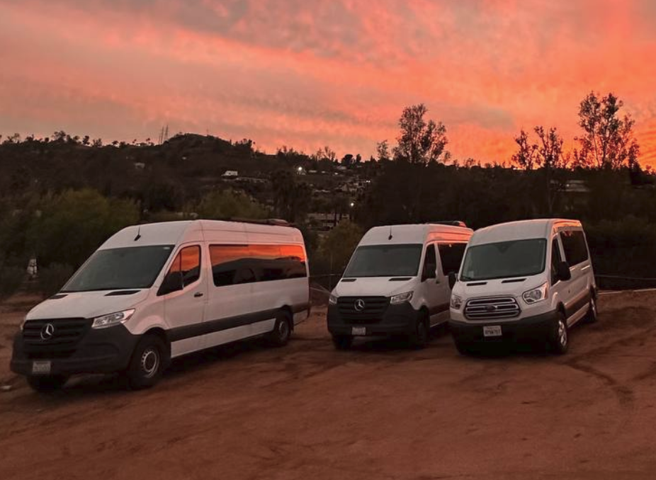 Sprinter Rentals Las Vegas fleet of passenger vans at sunset