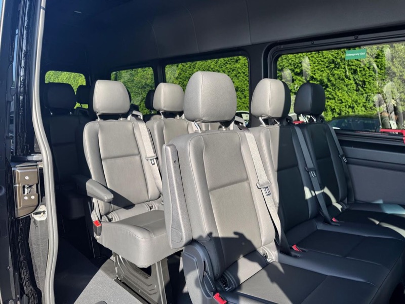 15-passenger black Sprinter van interior with leather seats in Los Angeles