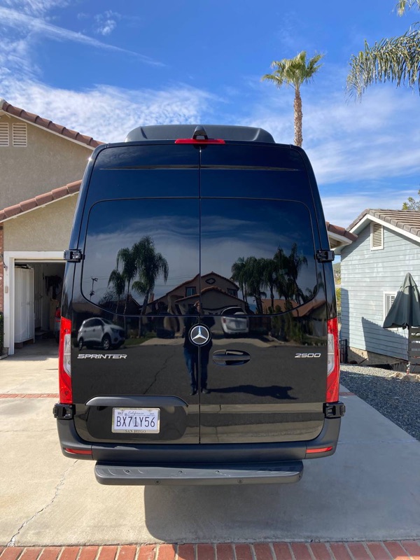 White Sprinter passenger van side view in Los Angeles