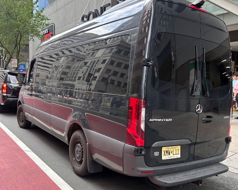 15-passenger Mercedes-Benz Sprinter van rental on a Manhattan street in New York City