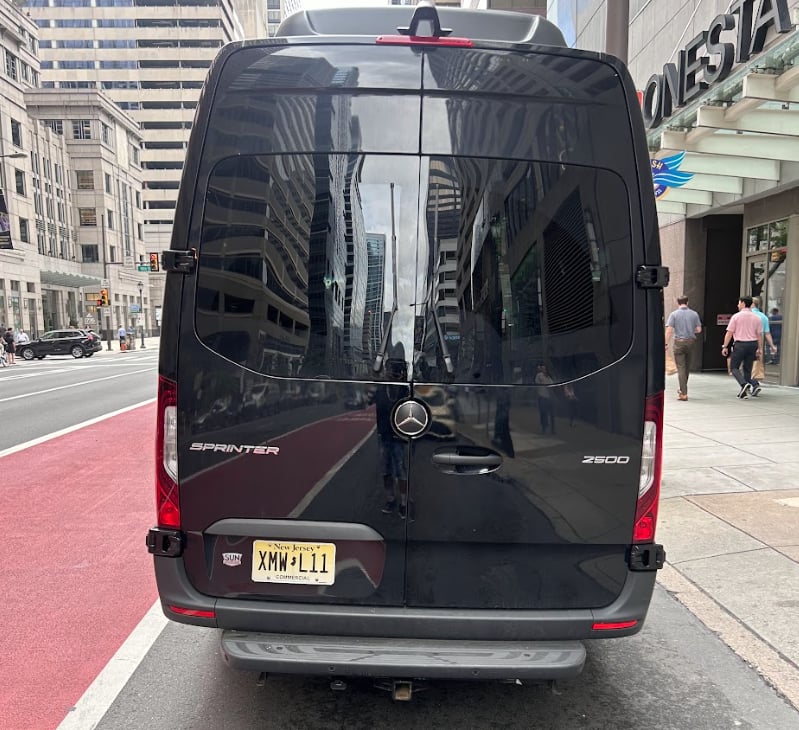 High roof Mercedes-Benz Sprinter 2500 van rental parked curbside in downtown New York