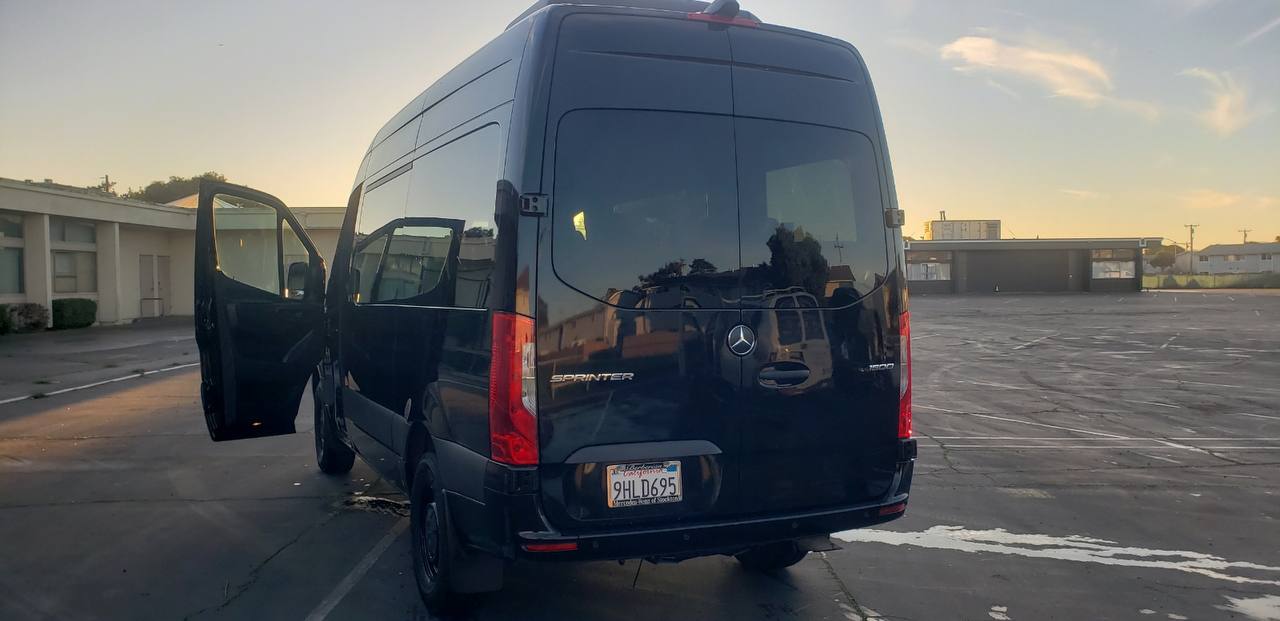 Black Mercedes-Benz Sprinter passenger van available for rent in Orange County, California