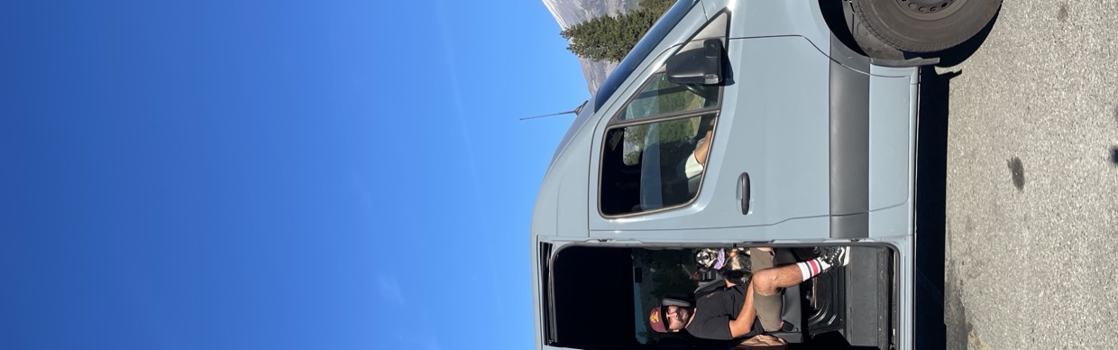 Sprinter camper van with open door in the Pacific Northwest mountains — Sprinter Rentals Portland Oregon location