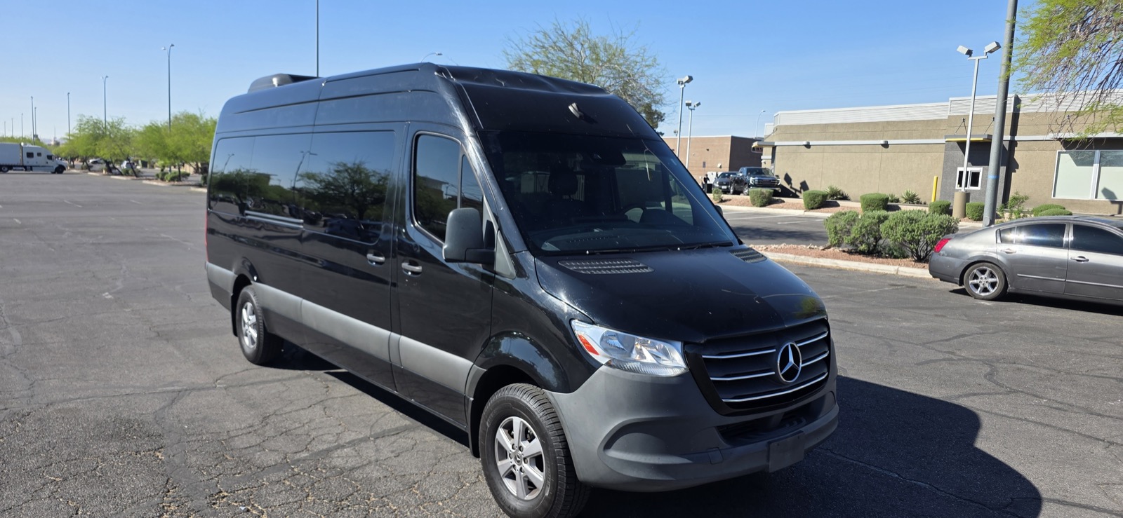12-passenger Sprinter van rental in Riverside with ample trunk space