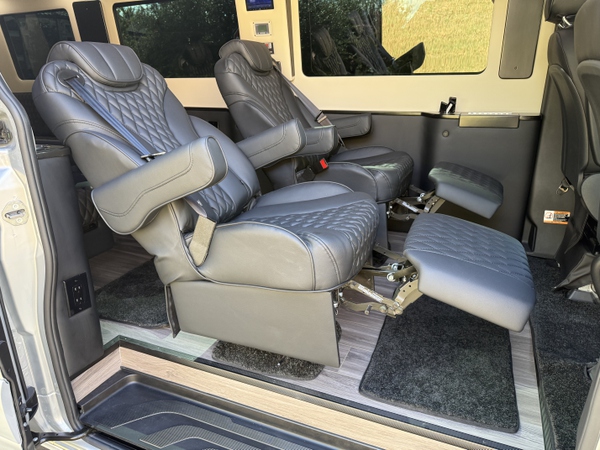 Sprinter van interior with reclined captain chairs and rear AC for San Antonio rentals