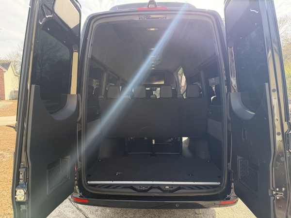 Mercedes-Benz Sprinter van with rear doors open showing spacious cargo space for St. Louis road trips