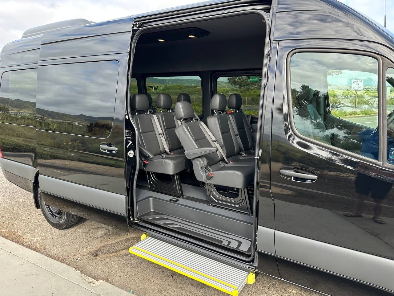 Black 15-seater Mercedes-Benz Sprinter passenger van with cargo space available for rent in Wichita Falls, TX