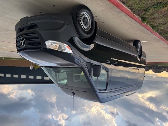 Front-right view of Mercedes-Benz Sprinter passenger van available for rent in Wichita Falls, TX