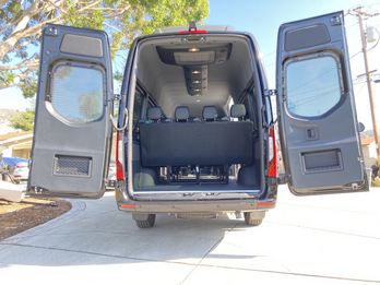 Rear doors open showing the seating and interior