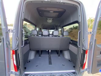 Rear doors open showing seats and cargo space