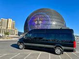 Van photographed with a city landmark in the background