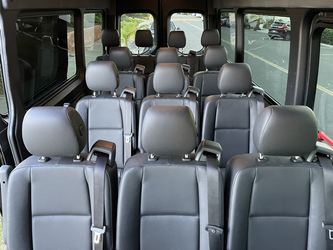 Rows of clean passenger seats inside the van