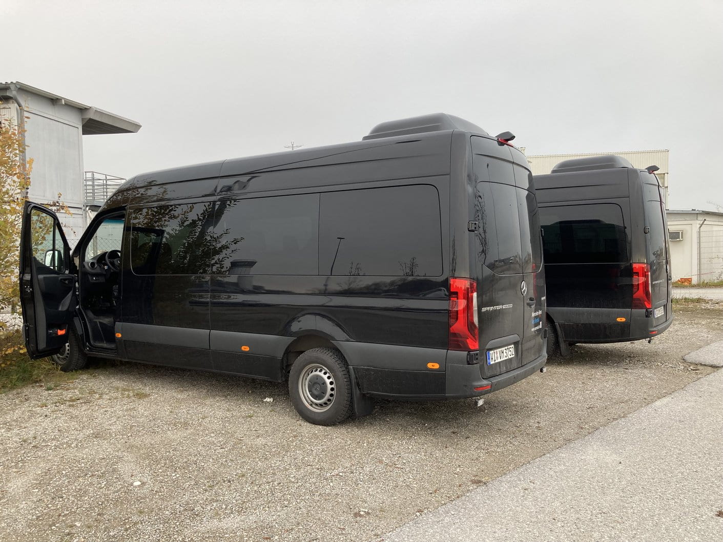 Two black Mercedes-Benz Sprinter 9 seater vans parked at our rental lot in southern Germany