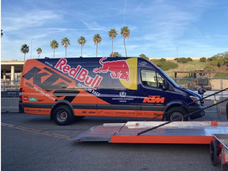 Red Bull KTM Factory Racing team sprinter van wrap in orange and navy